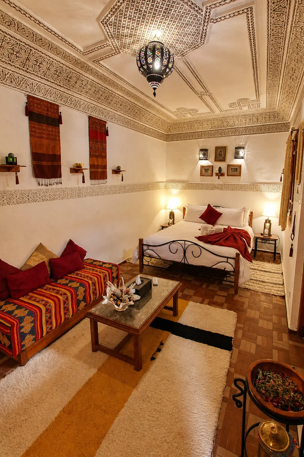 Carved plaster ceiling, a brass lantern and a striped banquette